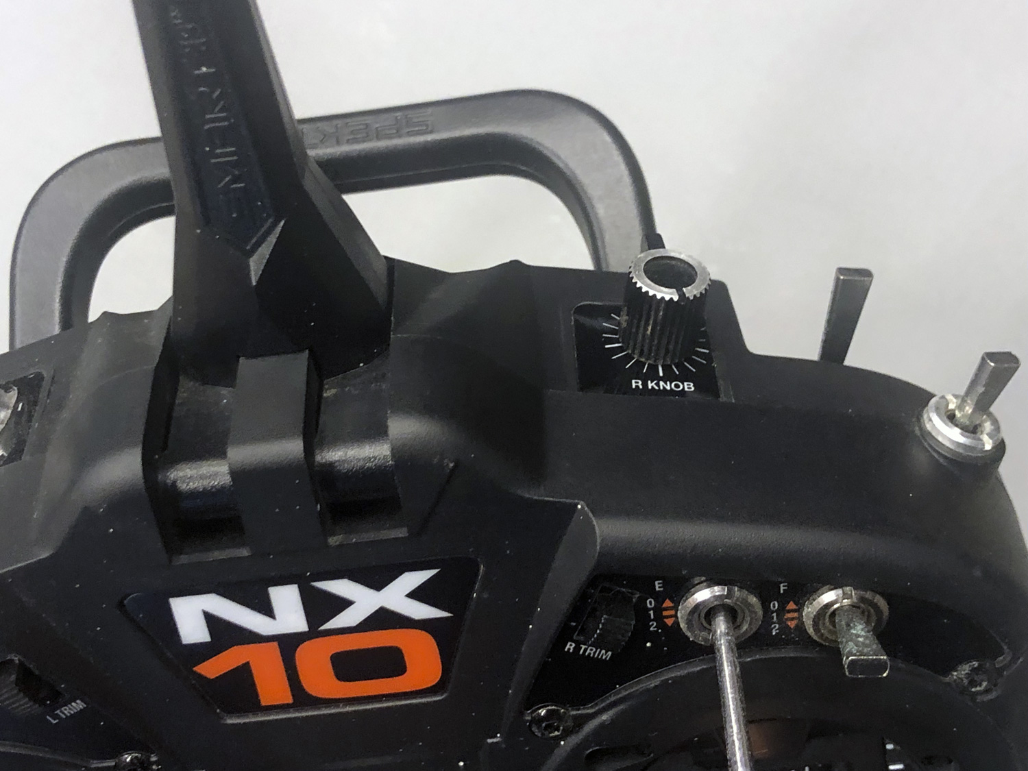 Close up of an adjustment knob for a remote control model helicopter transmitter