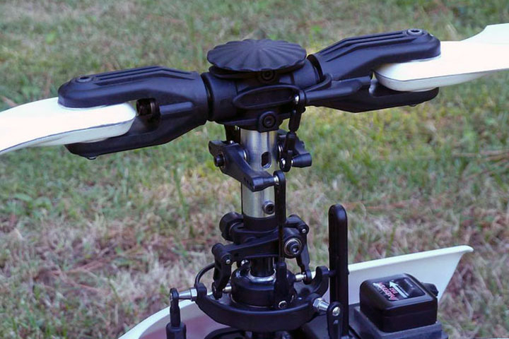 Close up photo of an RNFBL-conversion, which repurposes existing control arms and bearings into pitch-arm function