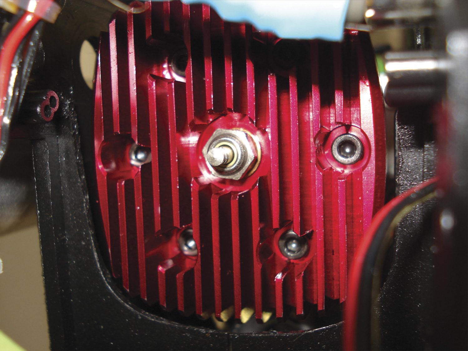 Photo of Yamada YS91SR red head within trimmed for clearance Pantera P6 cooling shroud