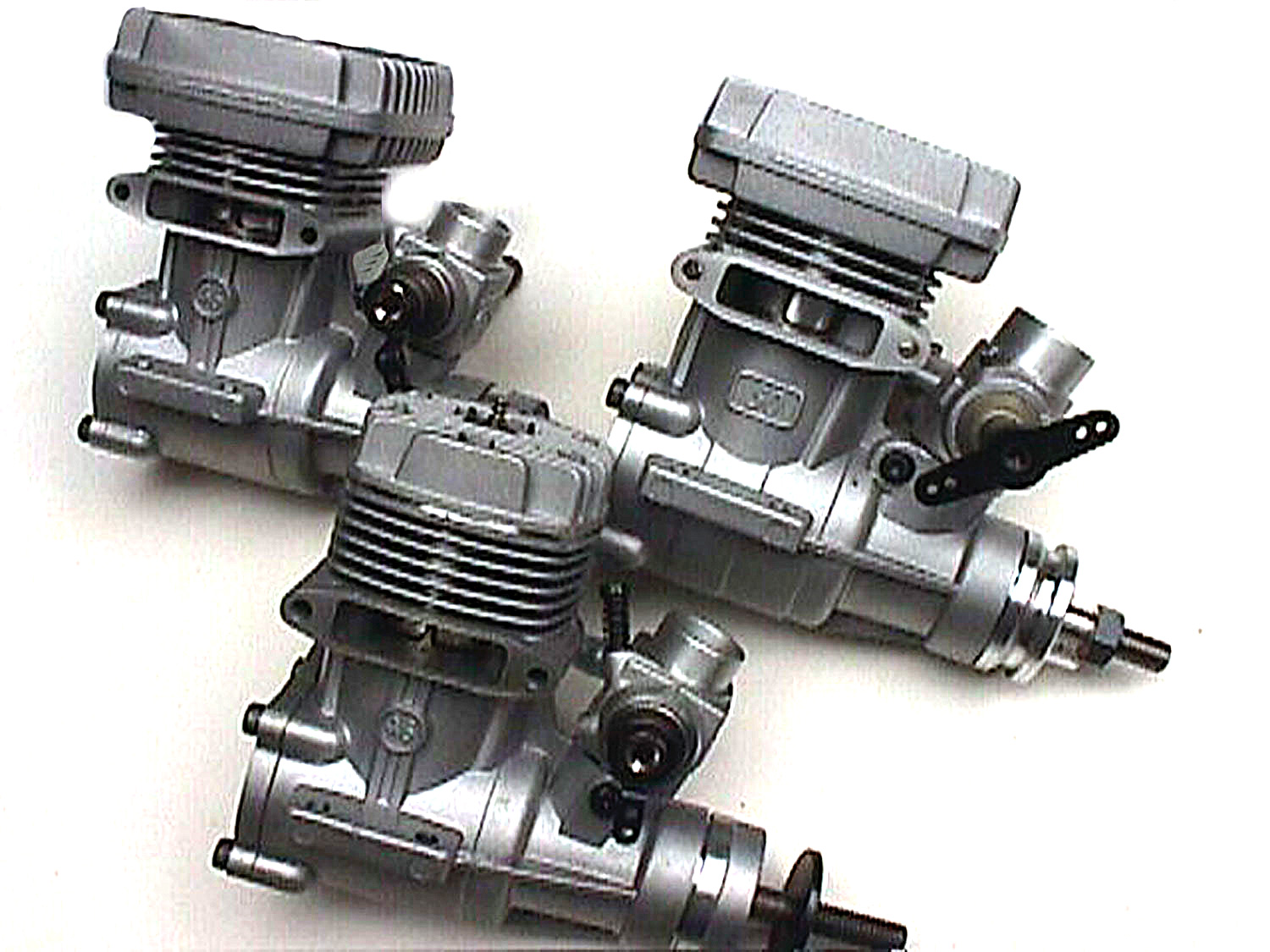 Poor quality photo of OS MAX 46FX, 46FX-Hring, and 50SX-Hring helicopter engines