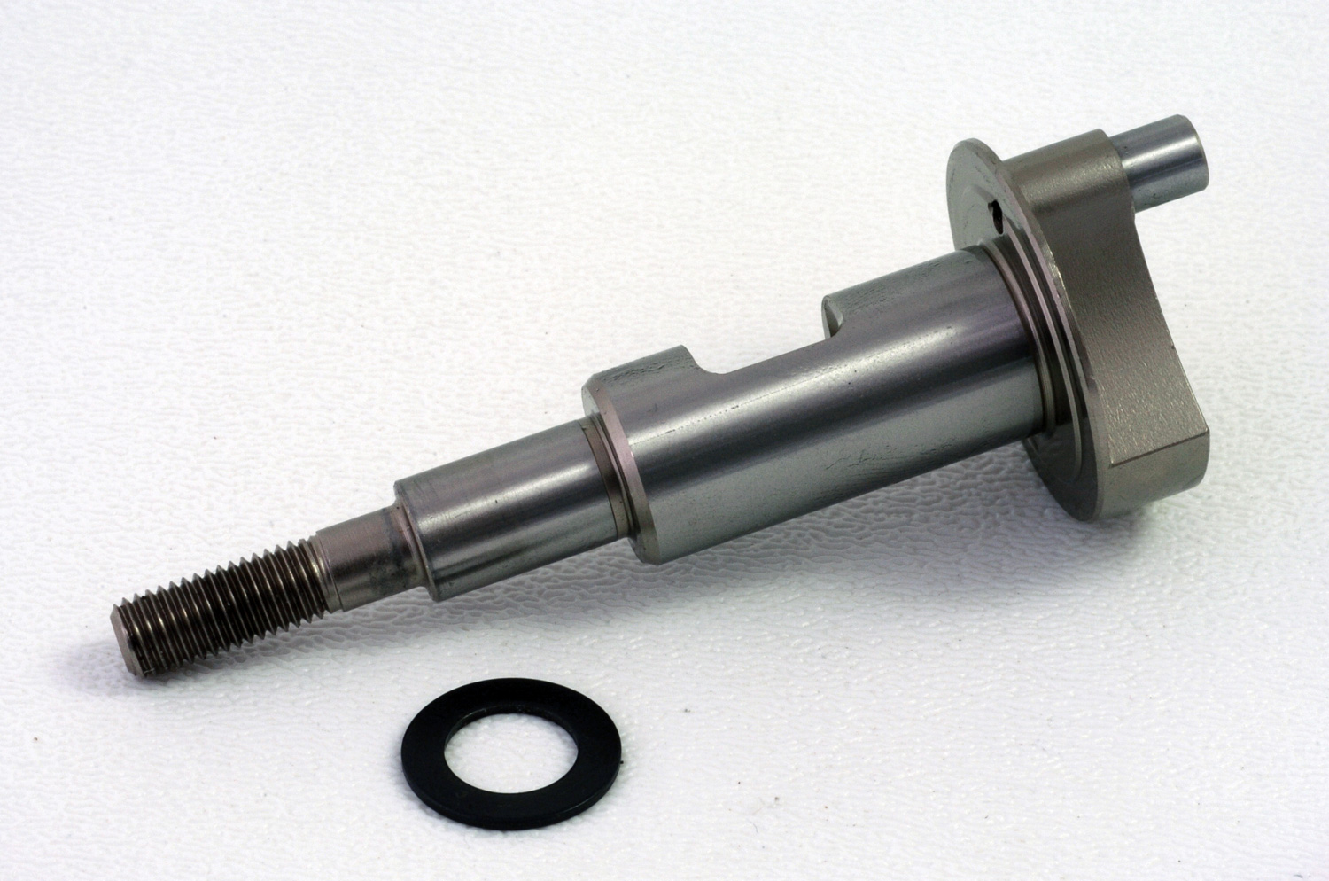 Photo of crankshaft setting on white surface