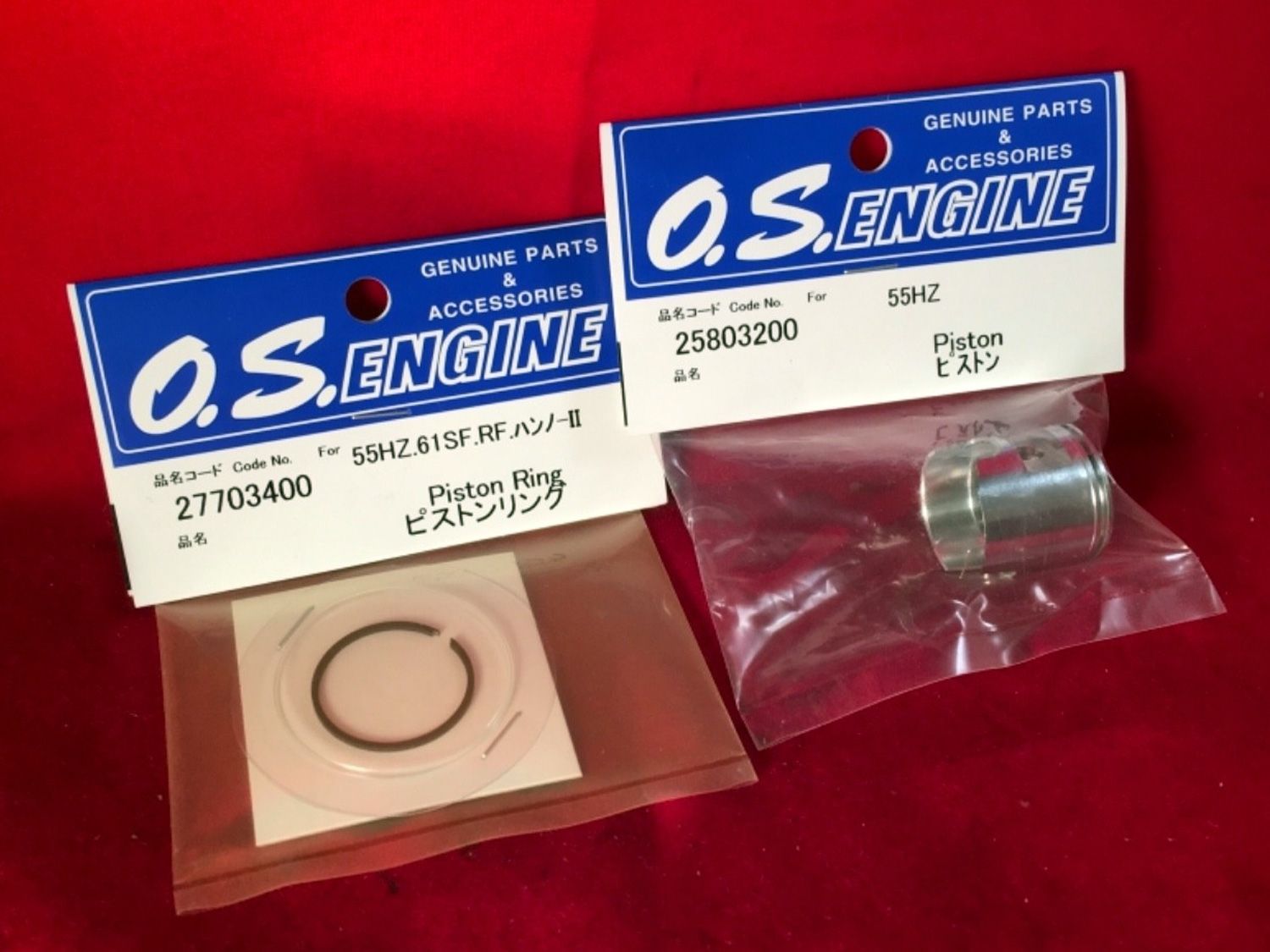 Close up of packages of OS MAX 55HZ piston and piston ring