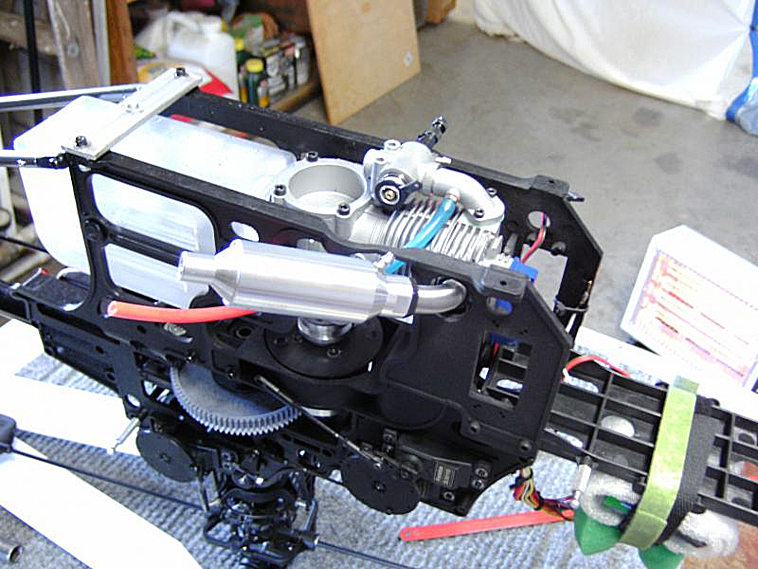 Photo of P6 inverted on the workbench showcasing the large four-stroke engine installed within the model’s side frames