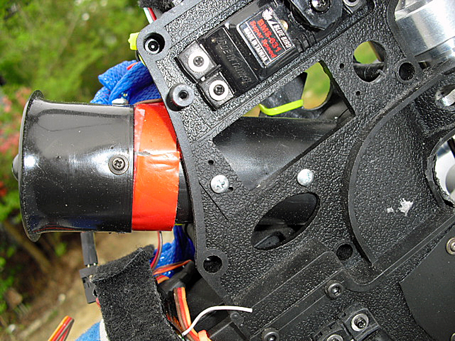 Photo of a free-flight ducted fan unit secured to the Audacity Models Pantera P6 frames to direct cooling air over the cylinder head of the four-stroke engine
