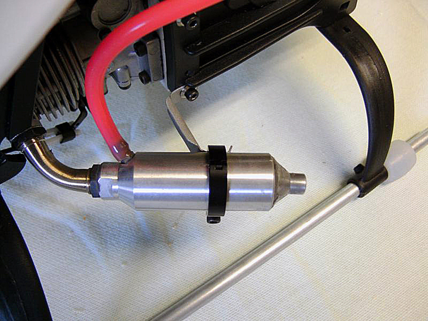 Close up photo of muffler support of stock four-stroke engine type muffler