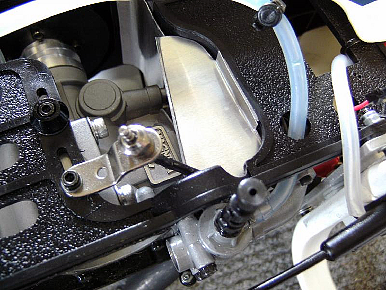 Close up photo of Magnum 91XL fitted to Pantera P6 side frames with a remote glow plug fitted plus cooling shroud extensions added to better funnel cooling air