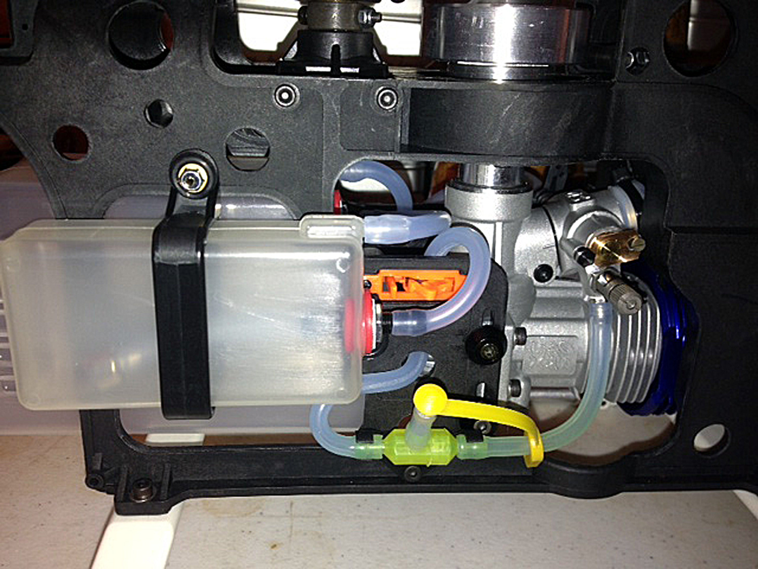 Close up photo of Pantera P6 hopper tank, AUD0090, shut off in orange AUD--29-SO, fuel filter T AUD0117, and fuel line cutoff AUD