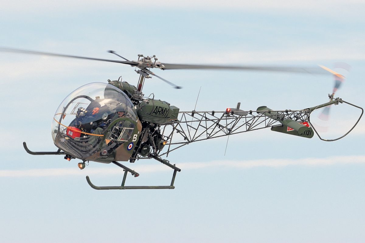 Close up shot of the classic MASH helicopter, the Bell-47 descending and turning toward the camera