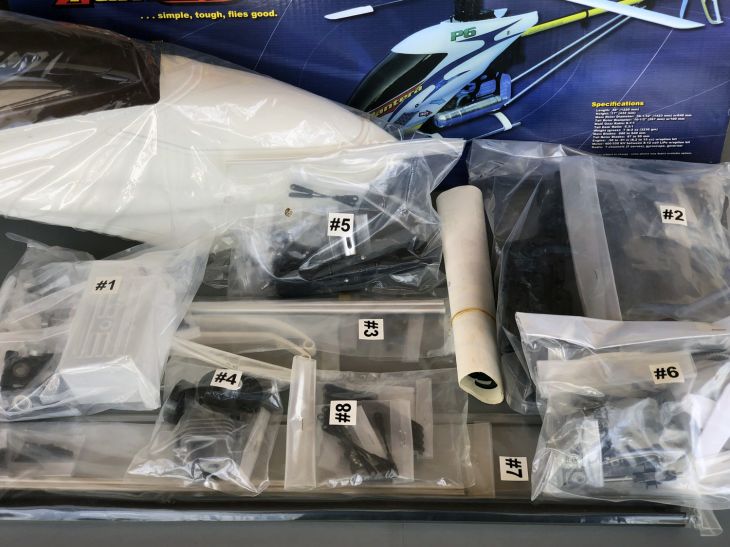 The contents of a P6 kit contained within numbered bags arrayed on a table top